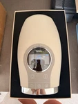 Breo Wowos Cordless Electric Hand Massager Beige Open. Price: $20.00.