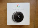New - Google Nest T3007ES Learning Thermostat A0013 Stainless Steel. Price: $100.00.