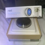 New Google Nest Learning Thermostat Temperature Sensor Silver Open. Price: $90.00.