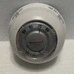 Honeywell Home Round Non-programmable Thermostat White Heat/cool Open. Price: $12.00.