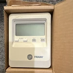 Trane BAYSTAT036A Programmable Thermostat Digital Display W/ Installer's Guide Open. Price: $50.00.