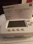 New Honeywell Thermostat With Manual. Price: $35.00.