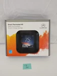 Alarm.com Smart Thermostat ADC-T40K-HD Black New/sealed. Price: $199.00.