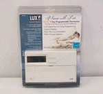 Lux TX9000 Smart Temp 7-DAY Programmable Thermostat New In Opened Package. Price: $44.99.
