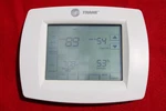 Trane TCONT803AS32DAA/TH8321U1030 7-DAY Programmable Touchscreen Thermostat Used. Price: $165.00.